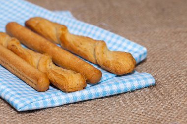 close up of salted bread stick on sack