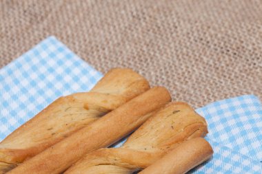 close up of salted bread stick on sack
