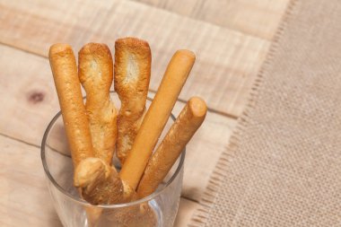 close up of salted bread stick on sack