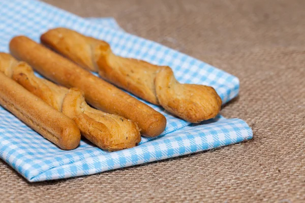 Close up of salted bread stick on sack — Stock Photo, Image