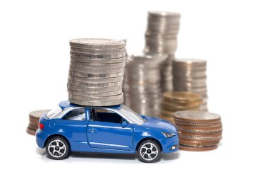 toy car and stack of coin isolated on white background