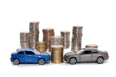 toy car and stack of coin isolated on white background