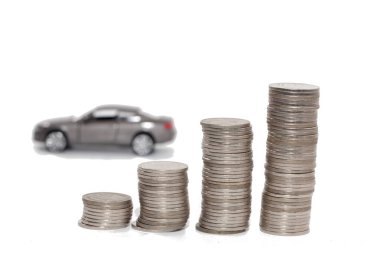 toy car and stack of coin isolated on white background