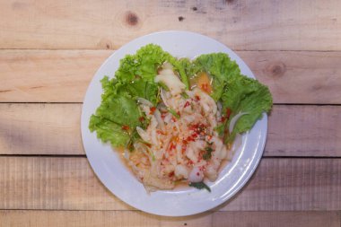 Thai Chicken Leg Salad & Spices on plate