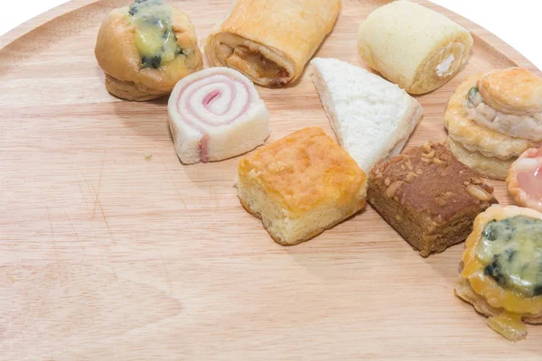 Una variedad de panadería en placa de madera — Foto de Stock