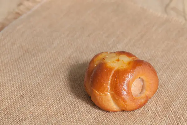 Close up of chicken sausage bun on sack — 스톡 사진