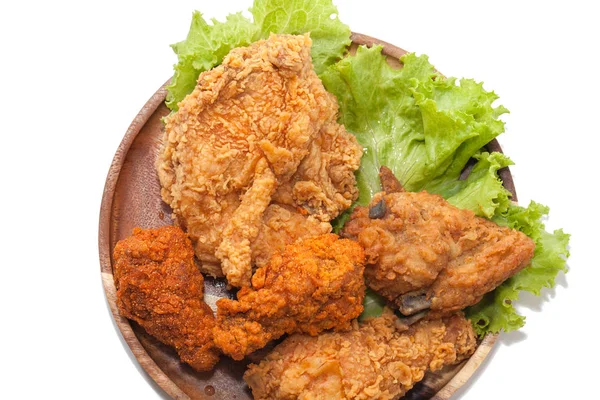 Close up of fried chickens on wooden plate — Stock Photo, Image