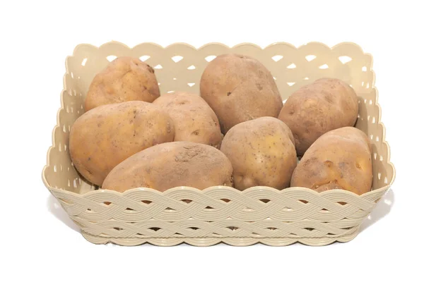 Närbild av hög med potatis i korgen — Stockfoto