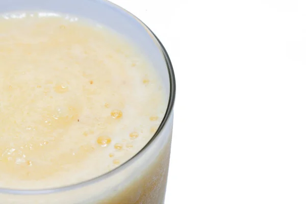 Close up of pineapple smoothie on glass — 스톡 사진