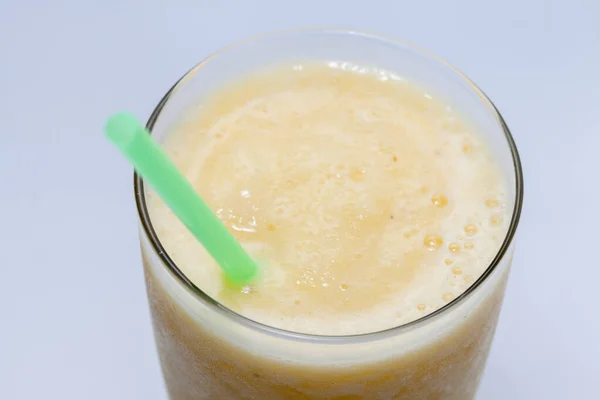 Close up of pineapple smoothie on glass — 스톡 사진