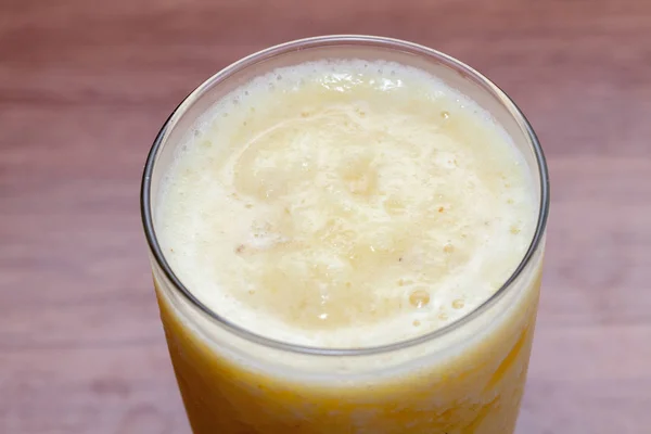 Close up of pineapple smoothie on glass — 스톡 사진