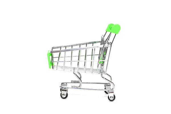 Close up of mini shopping cart on white background — ストック写真
