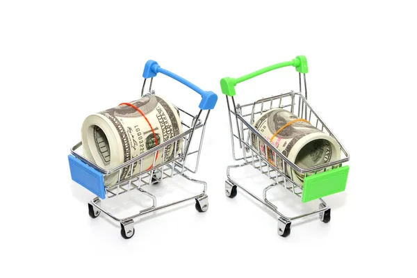 Close up of mini shopping cart with banknote on white background — Stock Photo, Image