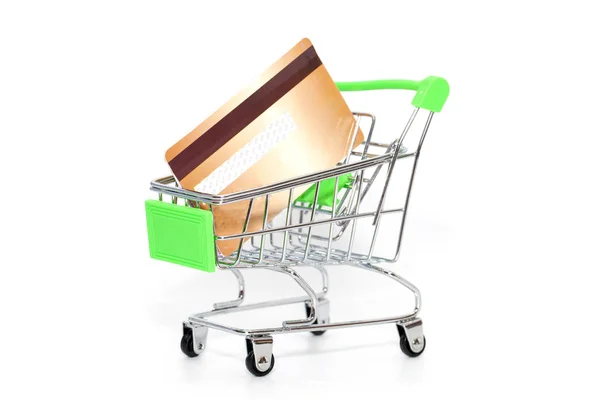 Mini shopping cart with credit card on white background — Stock Photo, Image