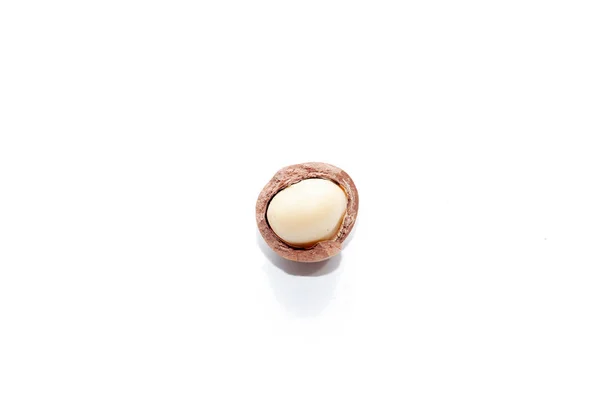 Close up of organic macadamia nut on white background — Stockfoto