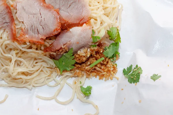 Egg noodle soup with red roasted pork in Wrapping Paper — ストック写真