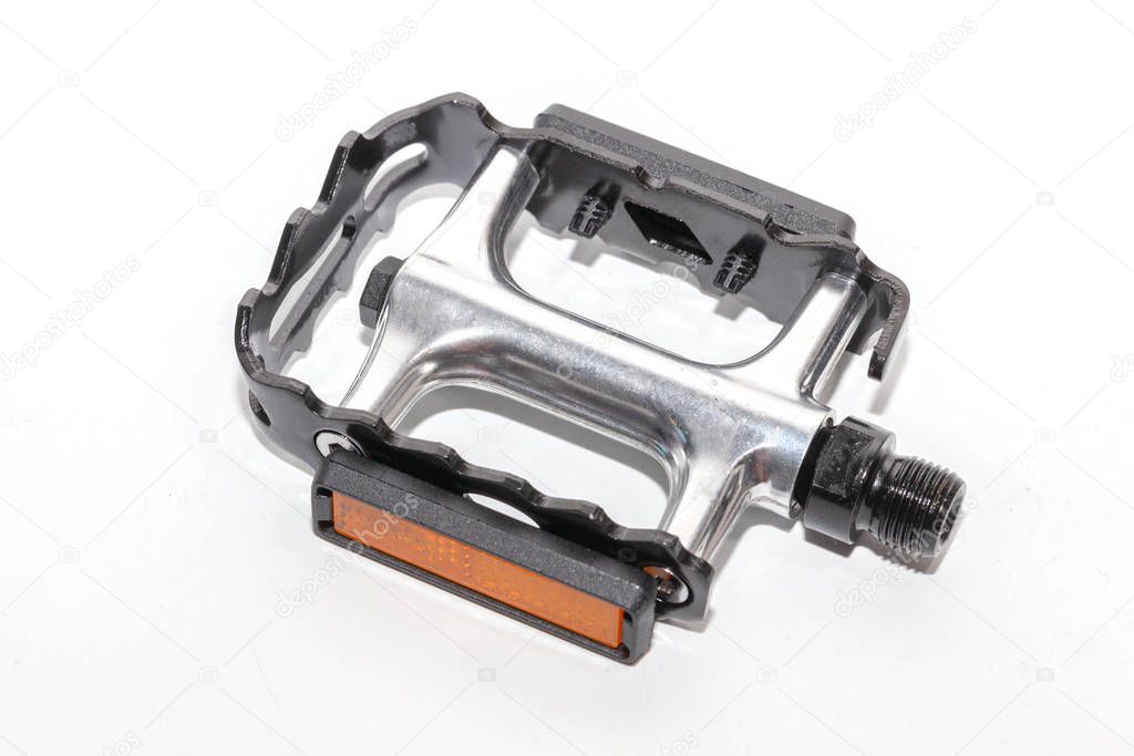close up of bicycle pedal on white background