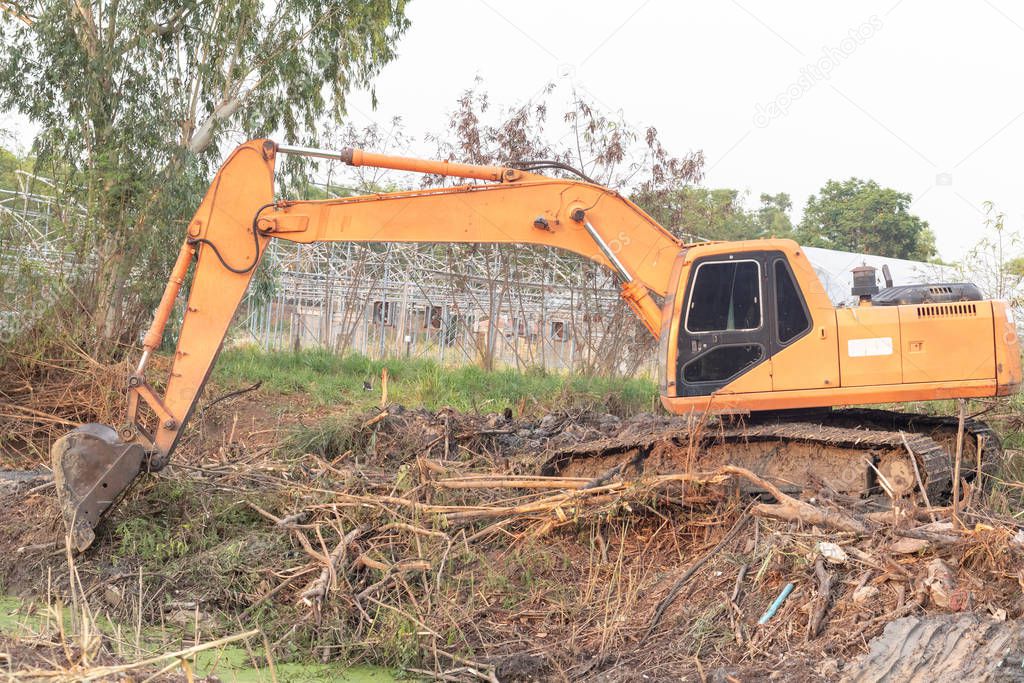 Excavator crawler in construction site build the pond