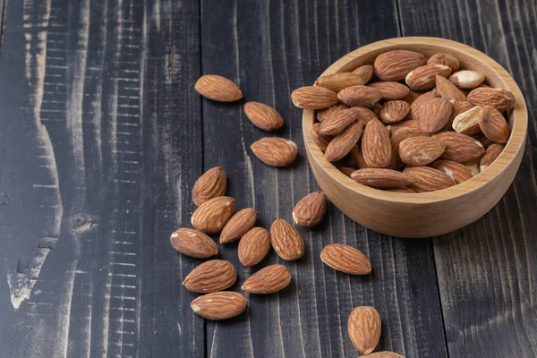 Close up of almond on wooden plate — ストック写真