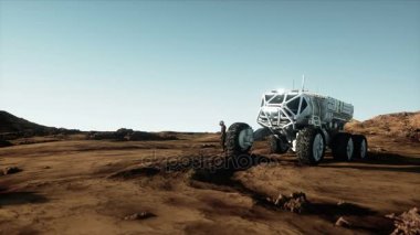 Astronot ve rover yabancı gezegende. Mars Mars. Sci fi - kavramı. Gerçekçi 4 k animasyon.