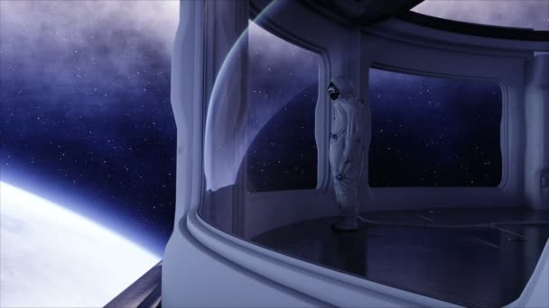 Astronauta solitario in astronave futuristica, stanza. vista della terra. filmati 4k cinematografici . — Video Stock