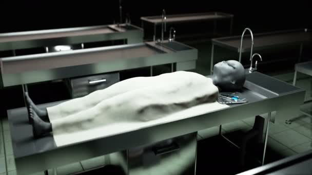 The dead alien in the morgue on the table. Futuristic autopsy concept. Cinematic 4k footage. — Stock Video