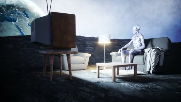 Funny alien watching TV on the sofa on the moon. Living on the moon concept. Earth background. 3d rendering. — Stock Video