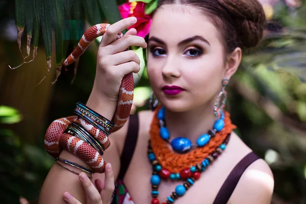Girl in ethnic clothes in tropical garden
