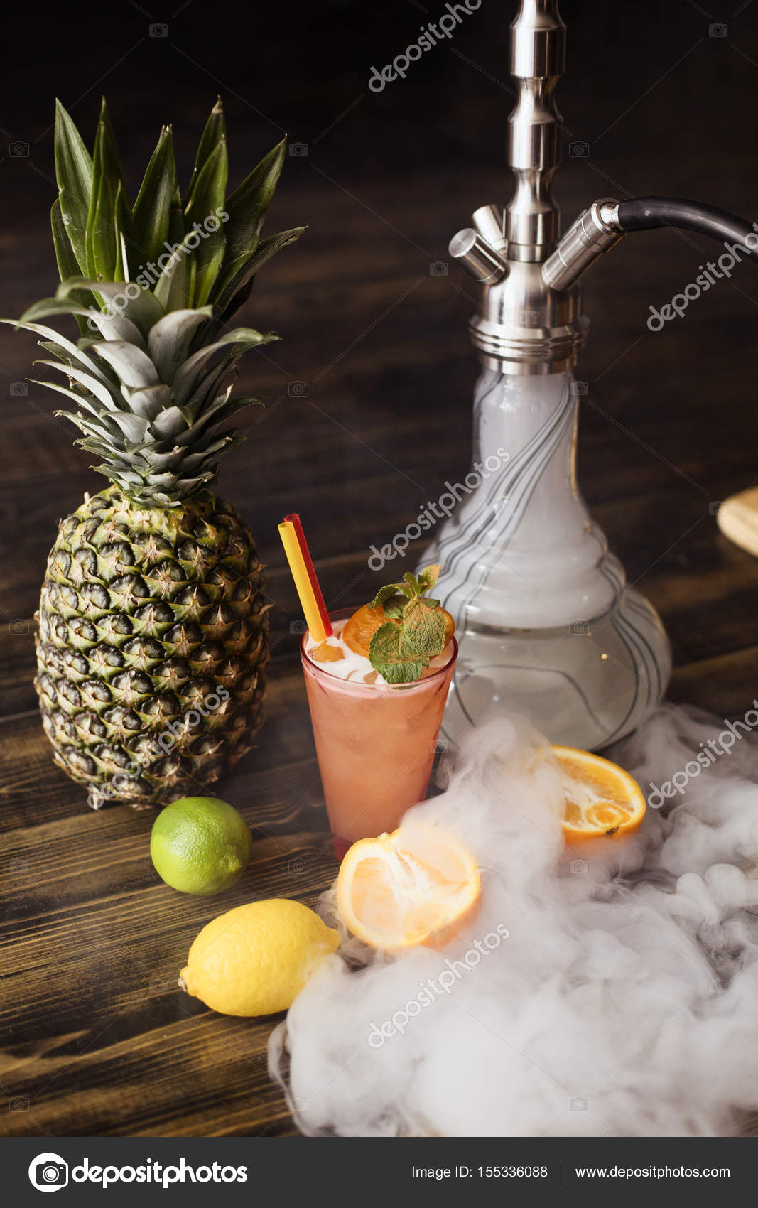 Hookah and cocktail on a table with exotic fruits Stock Photo by ©elenazhogoli.ua 155336088