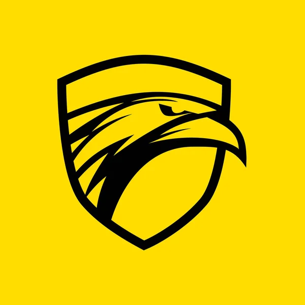 Logo de escudo de cabeza de águila sobre fondo amarillo — Vector de stock