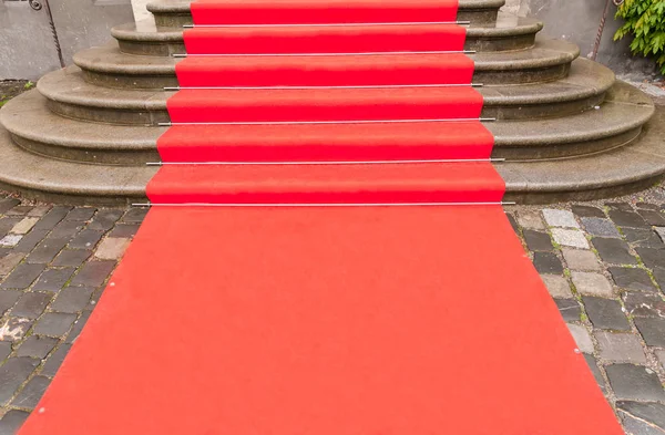 Red carpet on stairs — Stock Photo, Image