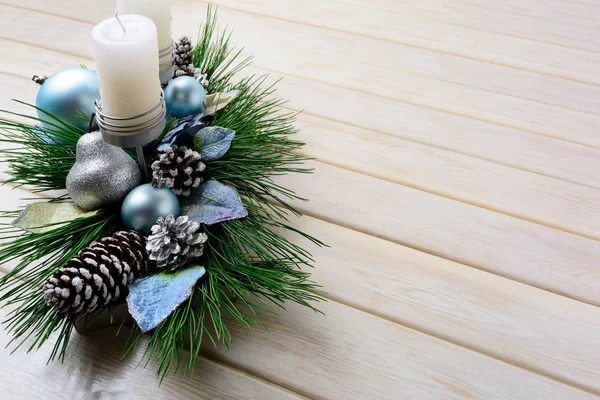 Christmas background with blue ornaments decorated candleholder