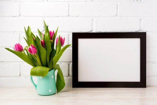 Black brown  landscape frame mockup with magenta tulips in mint