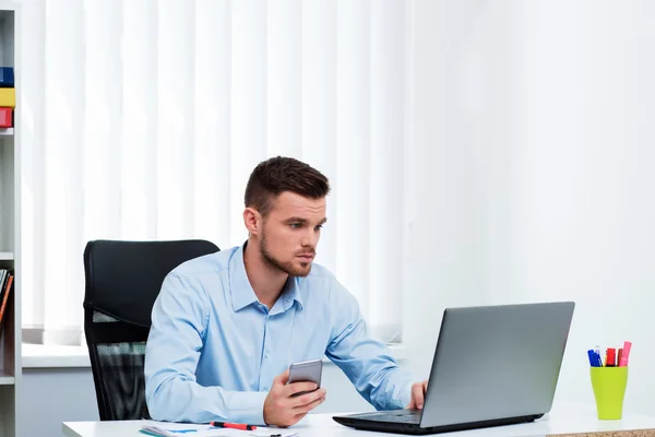 man in the office workplace laptop sitting on the table.