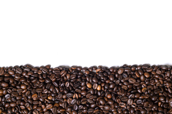 White background with coffee beans on the side. View from above with space for text. Still life. Mock-up. Flat lay