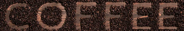 Inscription of coffee with coffee beans. — Stock Photo, Image