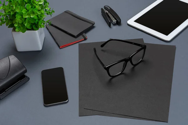Black office stuff collection flat lay. Top view on set of stationery with smartphone and tablet — Stock Photo, Image