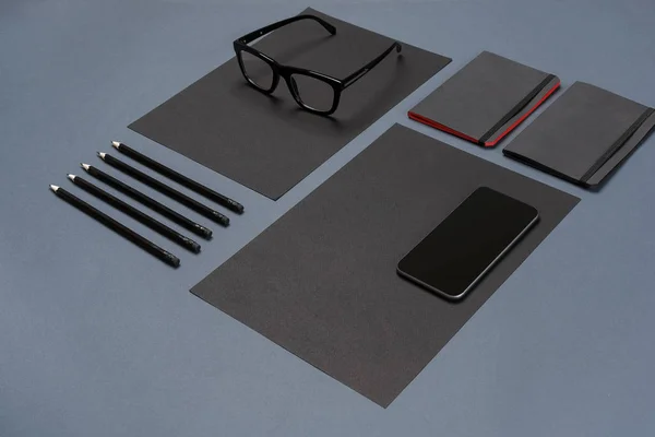 Modern mock up flat lay of notebook and stationery on gray background. — Stock Photo, Image