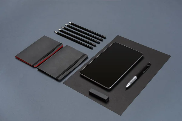 Set of black office stationery on a gray background, flat lay — Stock Photo, Image