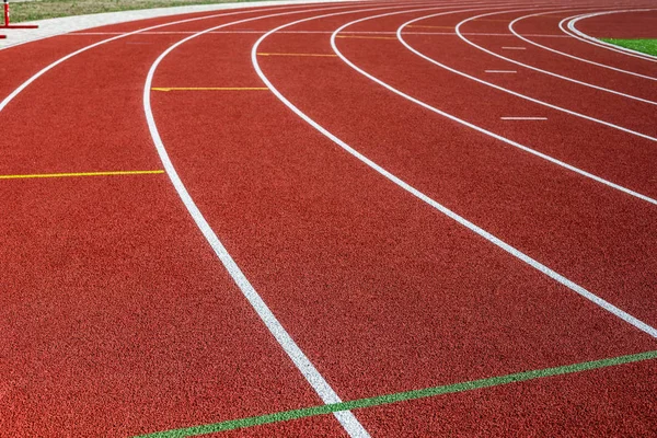 Red treadmill in sport field.