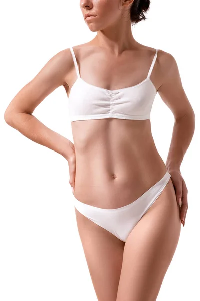Αδύνατο μαυρισμένο γυναικείο σώμα. Απομονωμένα σε λευκό φόντο. — Φωτογραφία Αρχείου