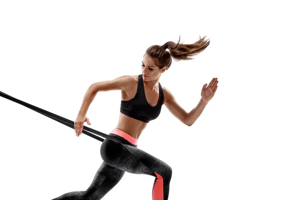 Žena cvičení fitness odpor kapely ve studiu silueta izolované na bílém pozadí — Stock fotografie