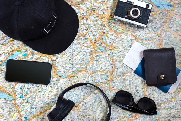 Travel plan, trip vacation accessories for trip, tourism mockup - Outfit of traveler on map background. Flat lay and copyspace.