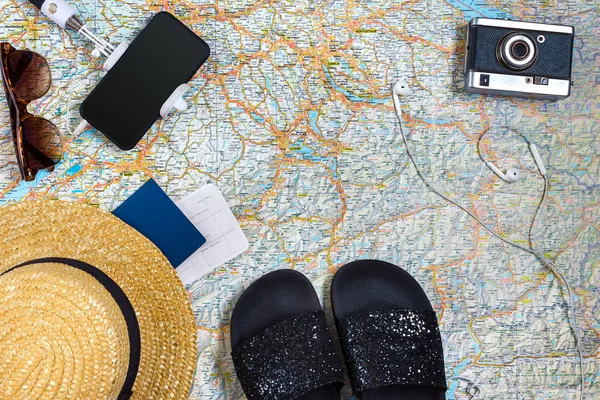 Travel plan, trip vacation accessories for trip, tourism mockup - Outfit of traveler on map background. Flat lay and copyspace.
