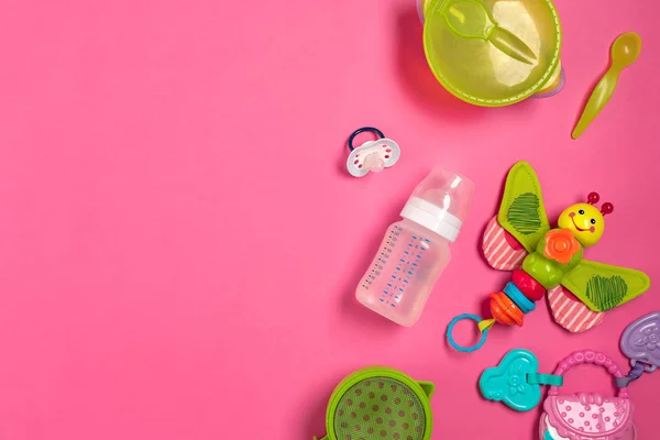 Baby toys and accessories on pink background. Top view — Stock Photo, Image