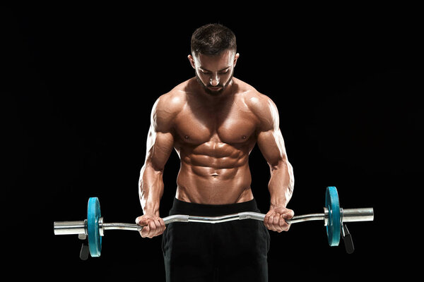 muscular man lifting weights over dark background