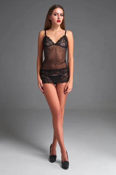 Beautiful brunette in black underwear — Stock Photo, Image