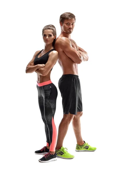 Kadın ve adam Studio beyaz arka plan üzerinde genç sporcuların Çift