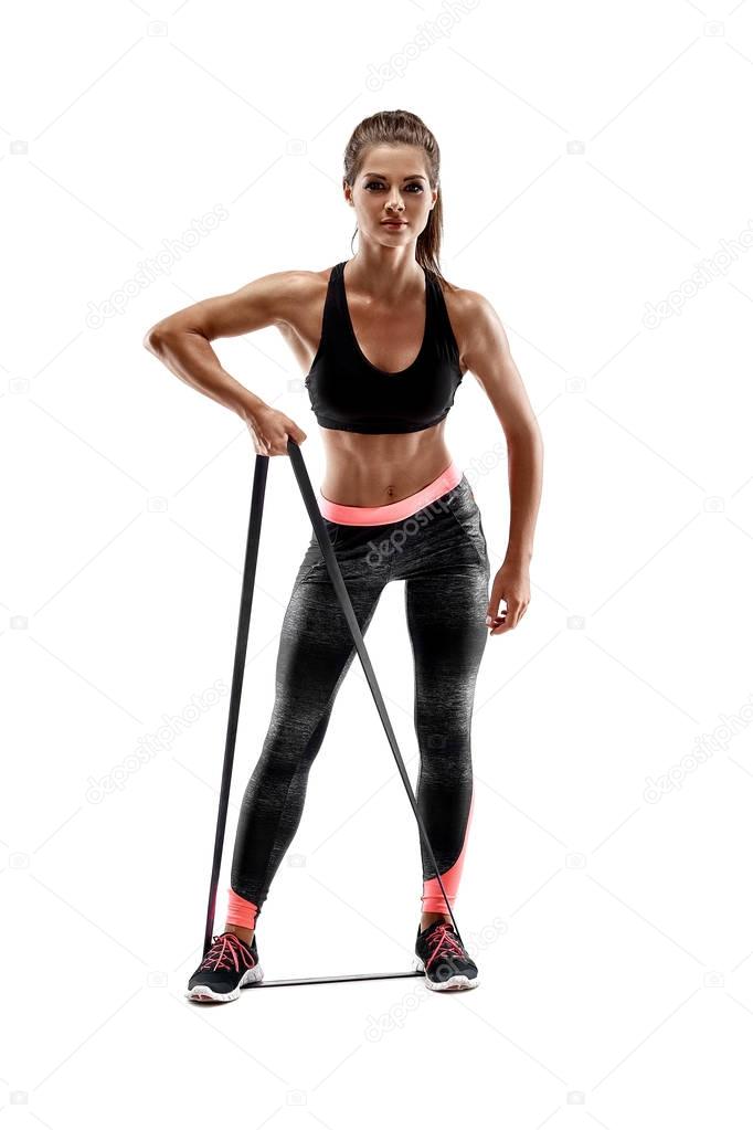 Woman exercising fitness resistance bands in studio silhouette isolated on white background