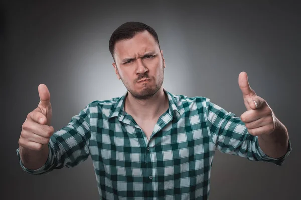 Portrait of excited man looking at the camera and points at you with a finger. — Stok Foto